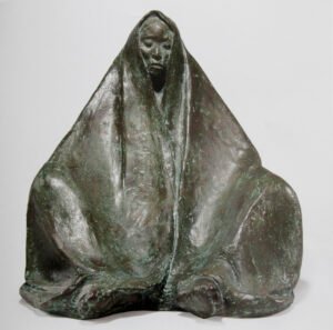 Mujer con rebozo sentada